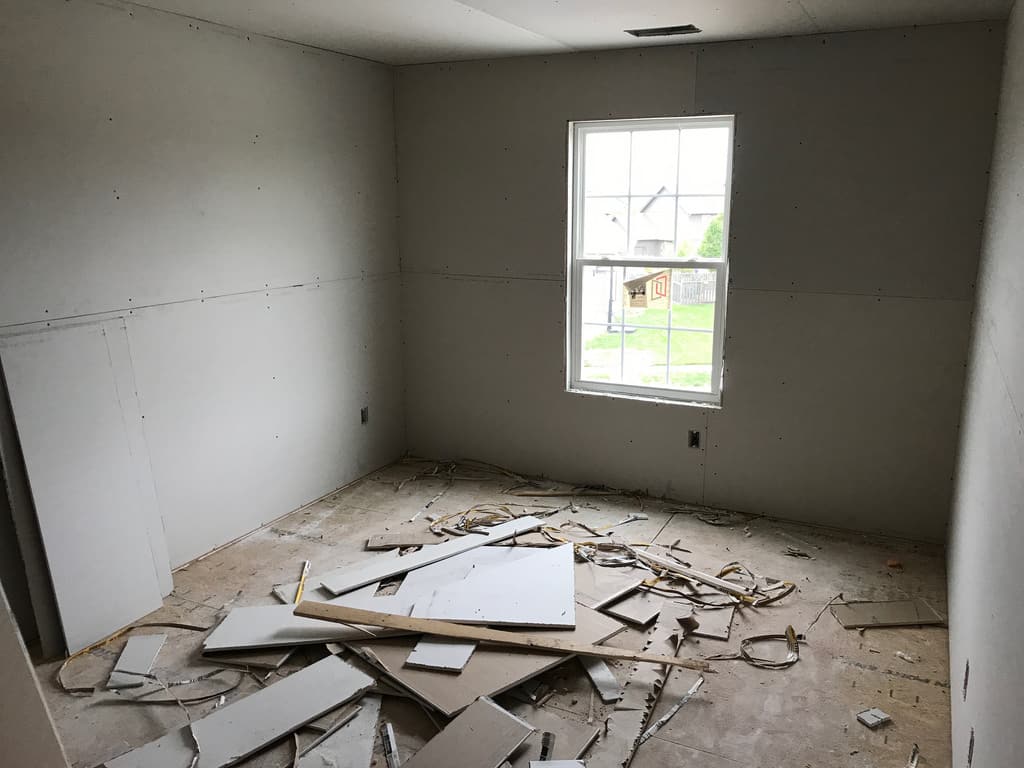 room that is ready for painting drywall