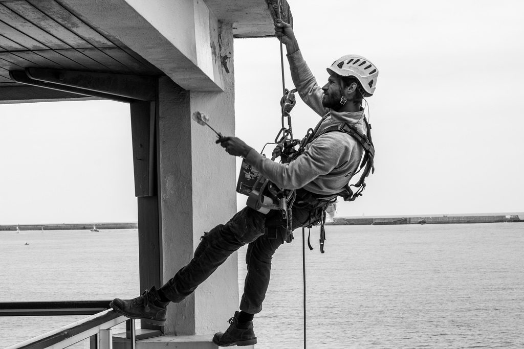 Worker preparing walls for painting