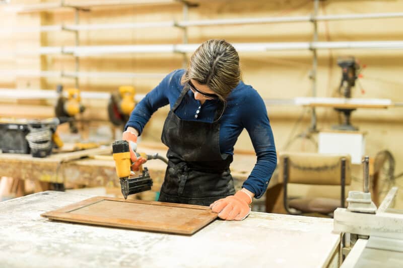 Woman using a quality brad nailer