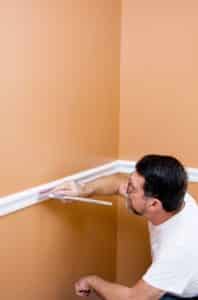 Man Painting Trim with Quality Paint