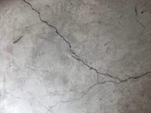 Concrete floor with cracks in paint