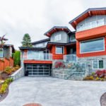 Nice house with black garage door paint simulating all glass door