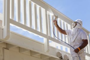 man spraying deck with pro paint sprayer 