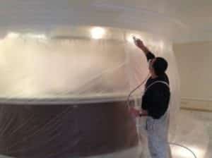 spraying paint interior wall