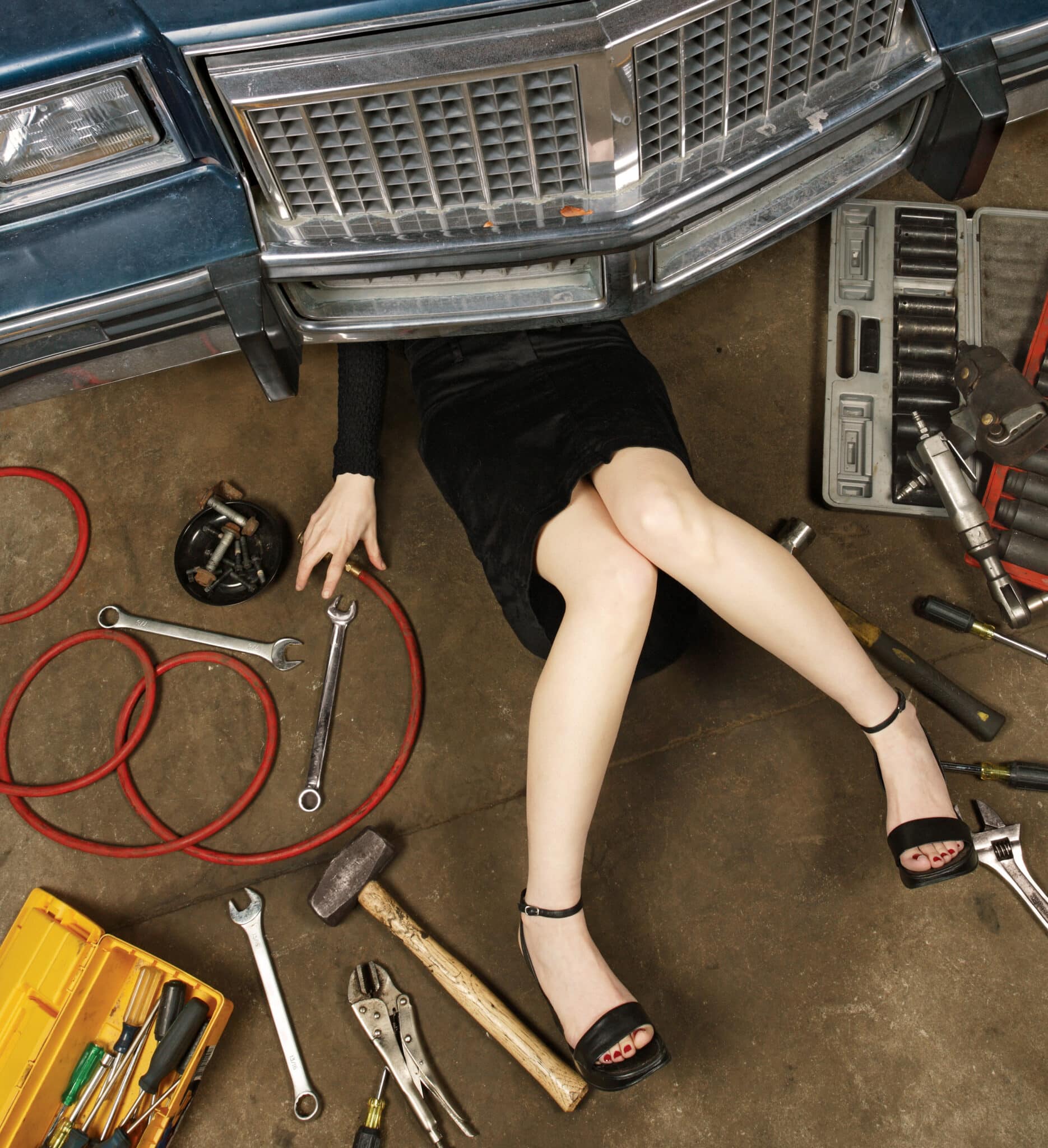 woman working on garage floor