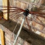 String is just around the top bristles