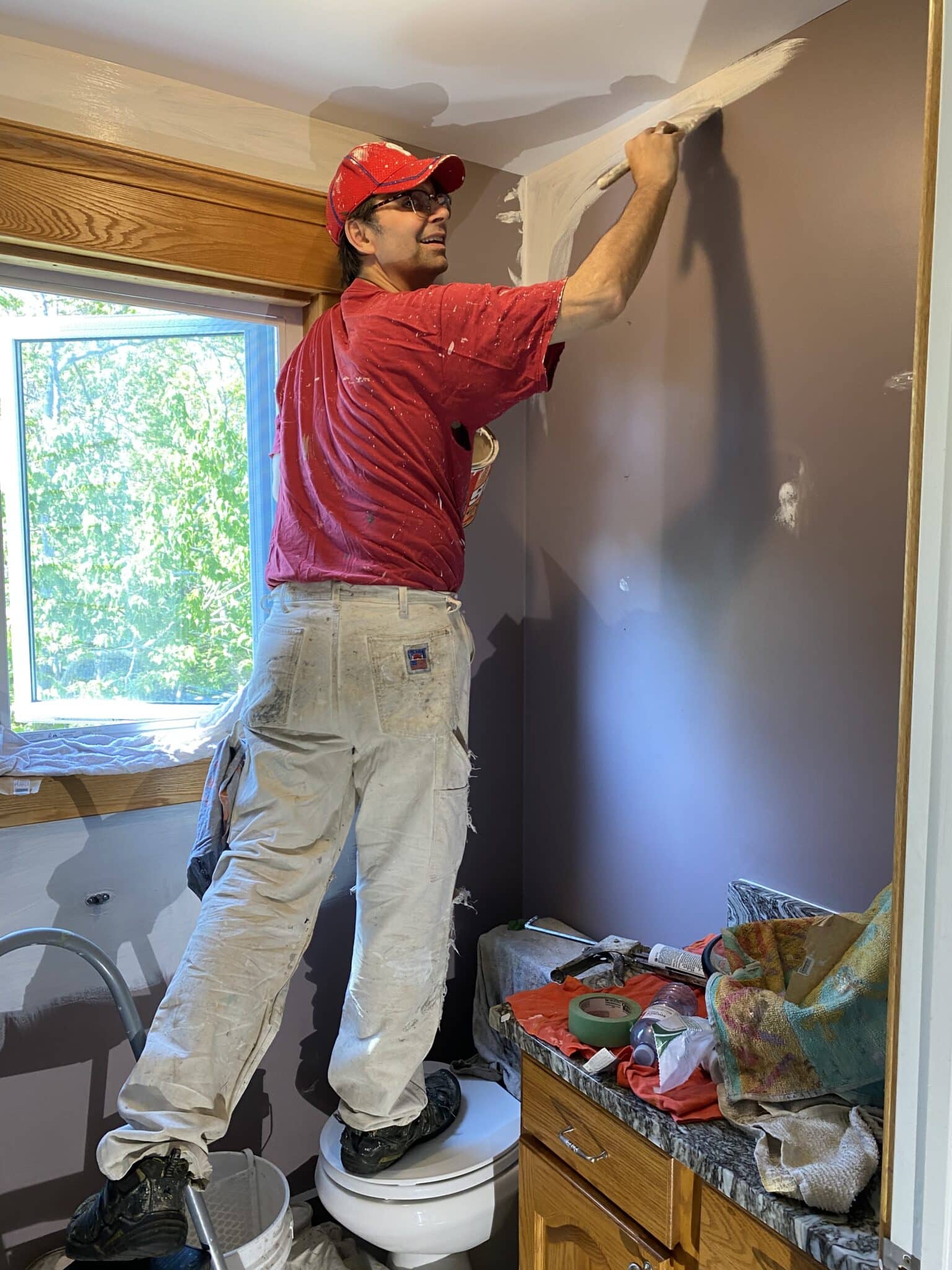 Brad the painter applying primer on a wall